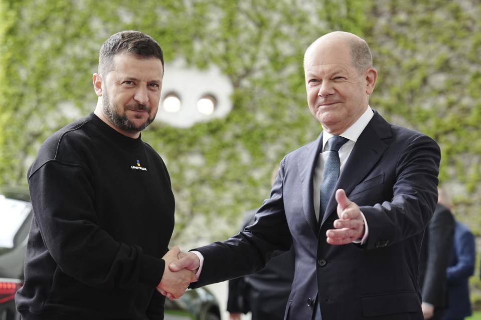 FILE - Ukrainian President Volodymyr Zelenskyy, left, is welcomed by German Chancellor Olaf Scholz at the federal Chancellery, in Berlin, Sunday, May 14, 2023. While the world awaits Ukraine's spring offensive, its leader Volodymyr Zelenskyy has already launched a diplomatic one. In a span of a week, he has dashed to Italy, the Vatican, Germany, France and Britain to shore up support for the defense of his country. On Friday, May 19, 2023, he was in Saudi Arabia to meet with Arab leaders, some of whom are allies with Moscow. (Kay Nietfeld/dpa via AP, File)