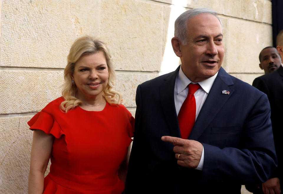 FILE PHOTO: Israeli Prime Minister Benjamin Netanyahu and his wife Sara Netanyahu stand next to the dedication plaque of the U.S. embassy in Jerusalem, after the dedication ceremony of the new U.S. embassy in Jerusalem, May 14, 2018. Picture taken May 14, 2018. REUTERS/Ronen Zvulun/File Photo