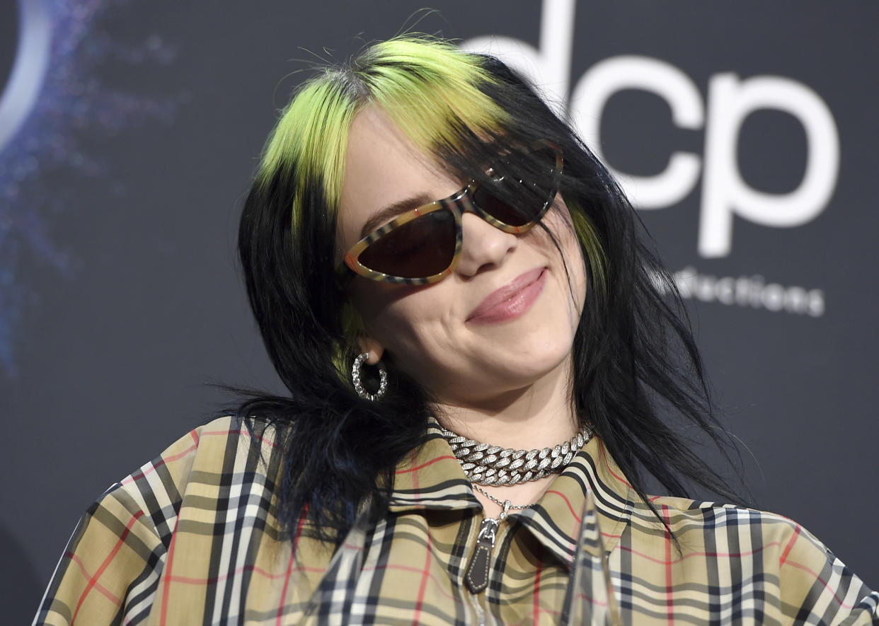 Billie Eilish poses in the press room after winning the award for new artist of the year and favorite alternative rock artist at the American Music Awards on Sunday, Nov. 24, 2019, at the Microsoft Theater in Los Angeles. (Photo by Jordan Strauss/Invision/AP)