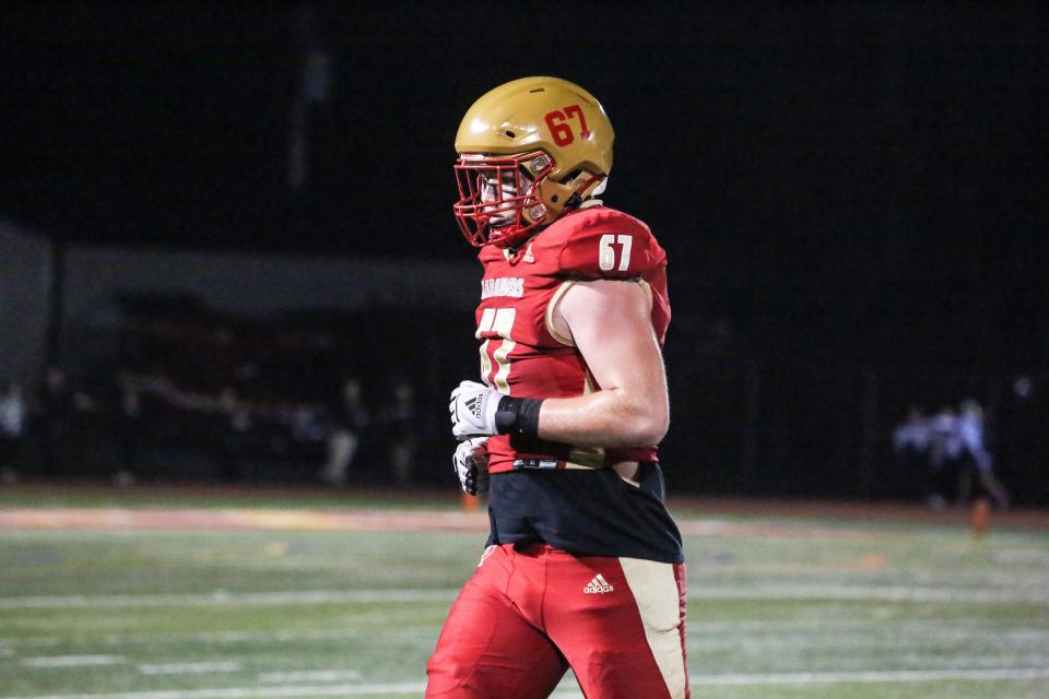 Mount Olive's Aidan Lynch leaves the field during the first half of a football game at Mount Olive High School on October 27, 2023.