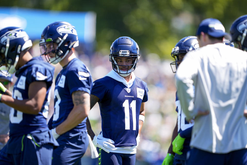 Seattle Seahawks rookie wide receiver Jaxon Smith-Njigba (11) is learning the ropes from two talented veterans in Tyler Lockett and DK Metcalf. (AP Photo/Lindsey Wasson)