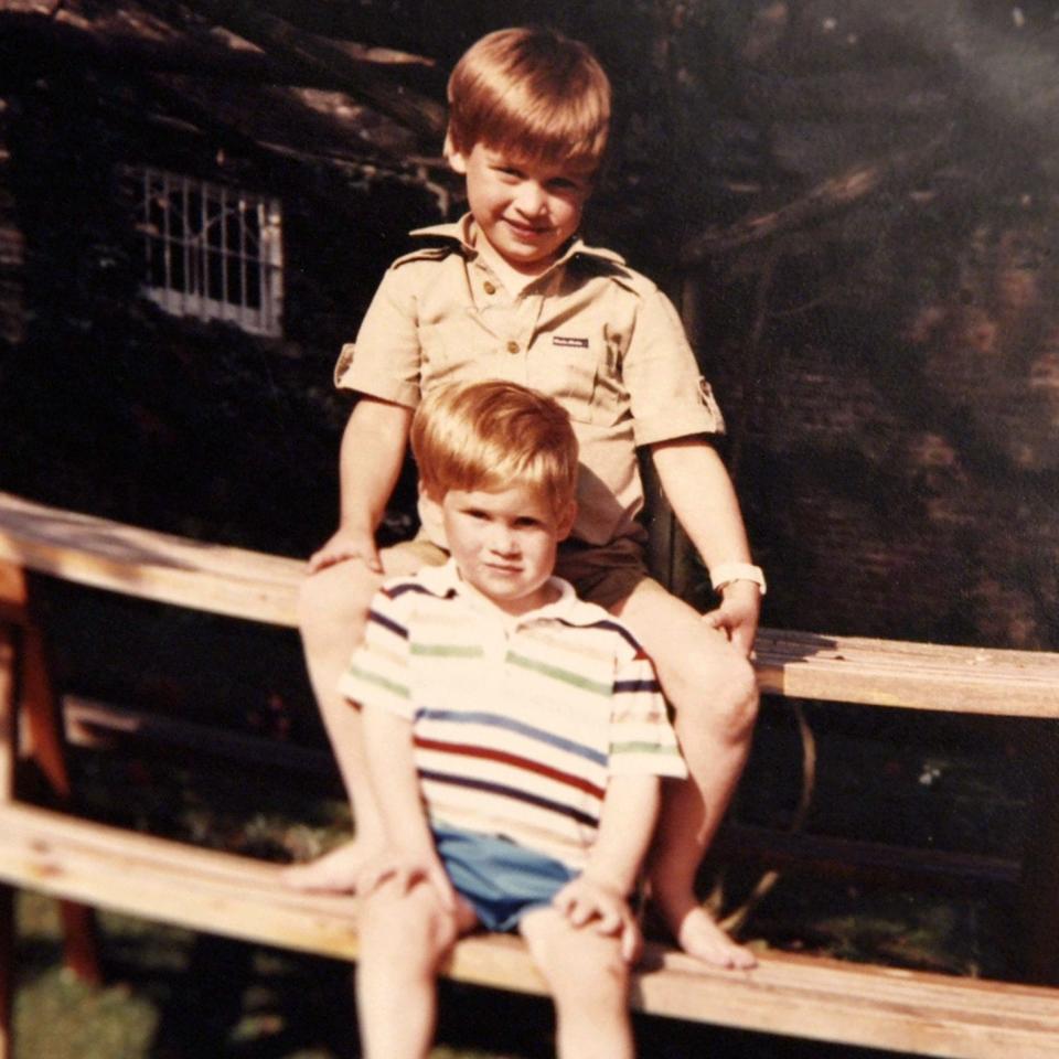 Prince William and Prince Harry sitting on a picnic bench together - Credit: The Duke of Cambridge and Prince