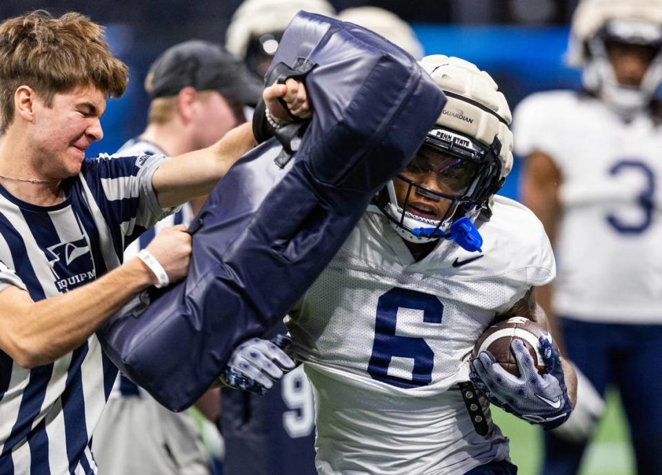 Penn State wide receiver Harrison Wallace III takes part in a drill during a Wednesday practice for the 2023 Chick-fil-A Peach Bowl at Mercedes-Benz Stadium in Atlanta. Penn State will face Ole Miss in the Saturday bowl game.