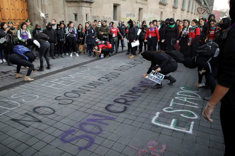 People take part in a protest against gender-based violence in downtown of Mexico City