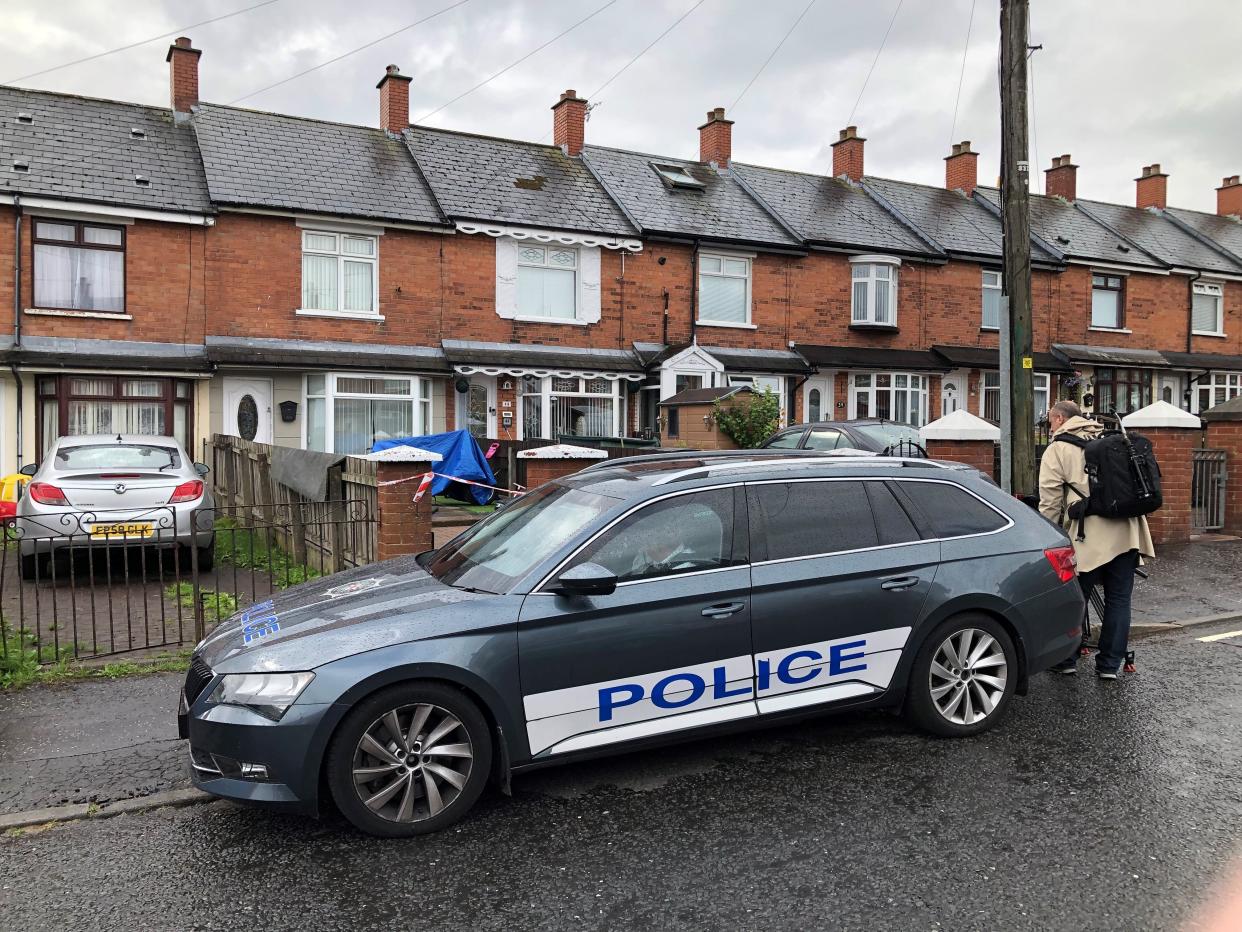 Police at the scene in Brompton Park, Belfast, where a baby died and another young child was critically injured (PA) (PA Wire)
