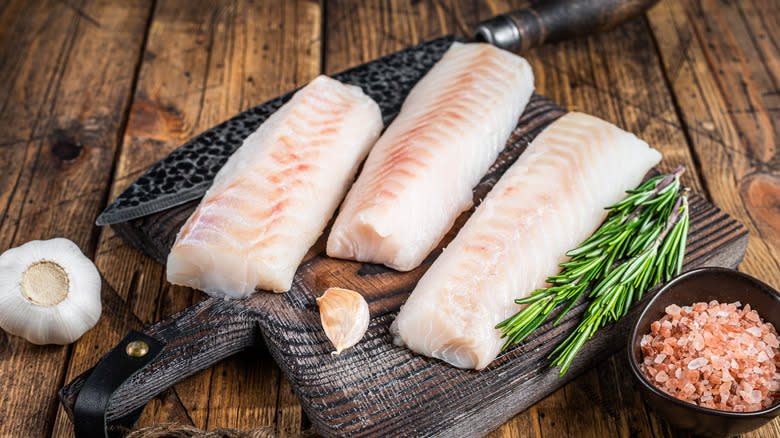 Cod filets on cutting board