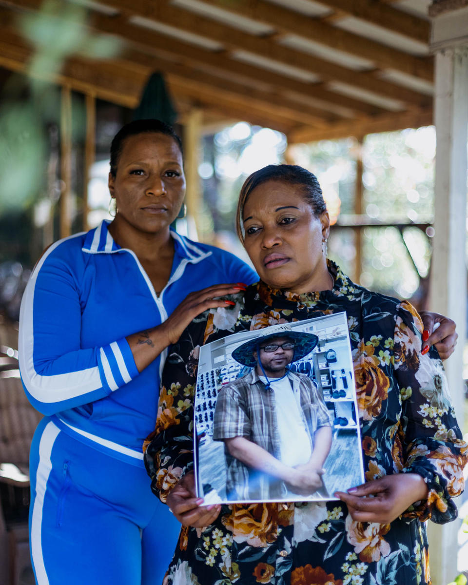 Image: Marquita & Mary Moore holds a photo of Mario Terrell Moore (Imani Khayyam for NBC News)