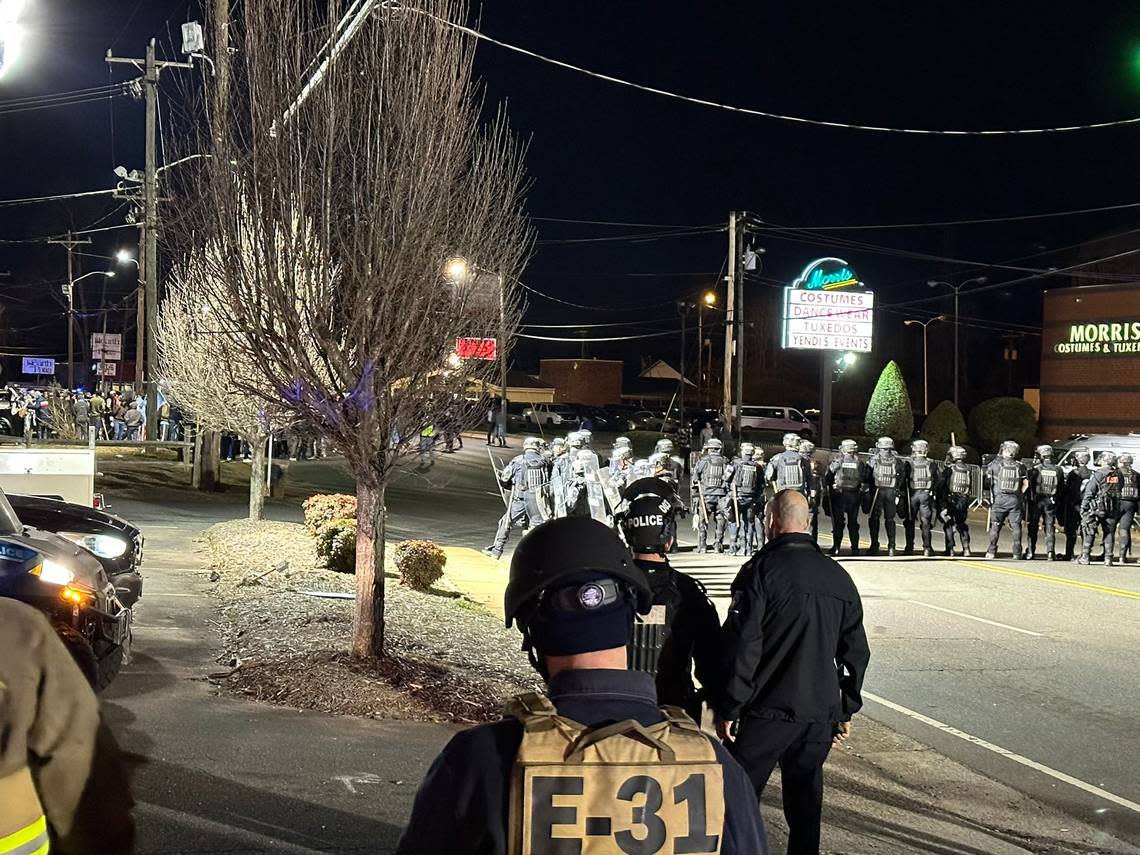 Police in riot gear confront protesters on Monroe Road Saturday, Feb. 17. The protest targeted a group of people participating in an Eritrean cultural festival. Charlotte-Mecklenburg Police