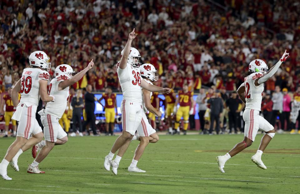 Utah Utes place kicker Cole Becker (36) and teammates celebrate after Becker kicked the game-winning field goal in the game against the USC Trojans at the Los Angeles Memorial Coliseum on Saturday, Oct. 21, 2023. | Laura Seitz, Deseret News