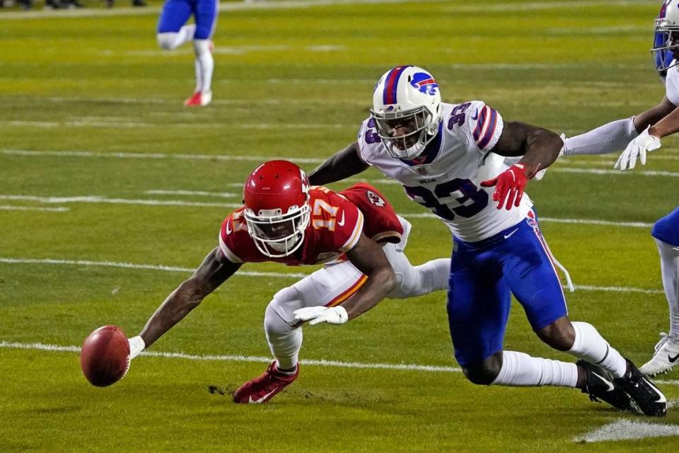 Kansas City Chiefs wide receiver Mecole Hardman (17) fumbles a punt in front of Buffalo Bills cornerback Siran Neal (33) during the first half of the AFC championship NFL football game, Sunday, Jan. 24, 2021, in Kansas City, Mo. Buffalo recovered the fumble.