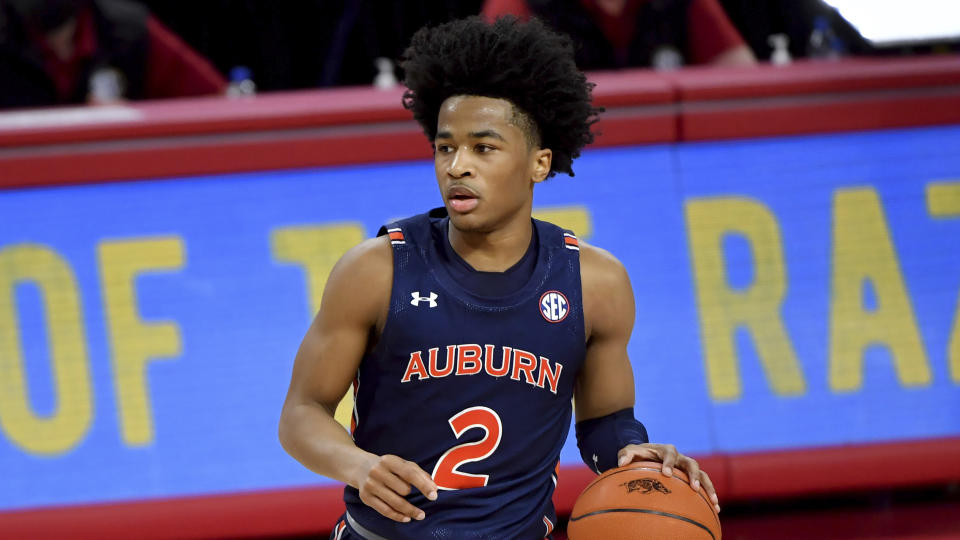 Auburn guard Sharife Cooper runs a play against Arkansas during an NCAA college basketball game Wednesday, Jan. 20, 2021, in Fayetteville, Ark. (AP Photo/Michael Woods)