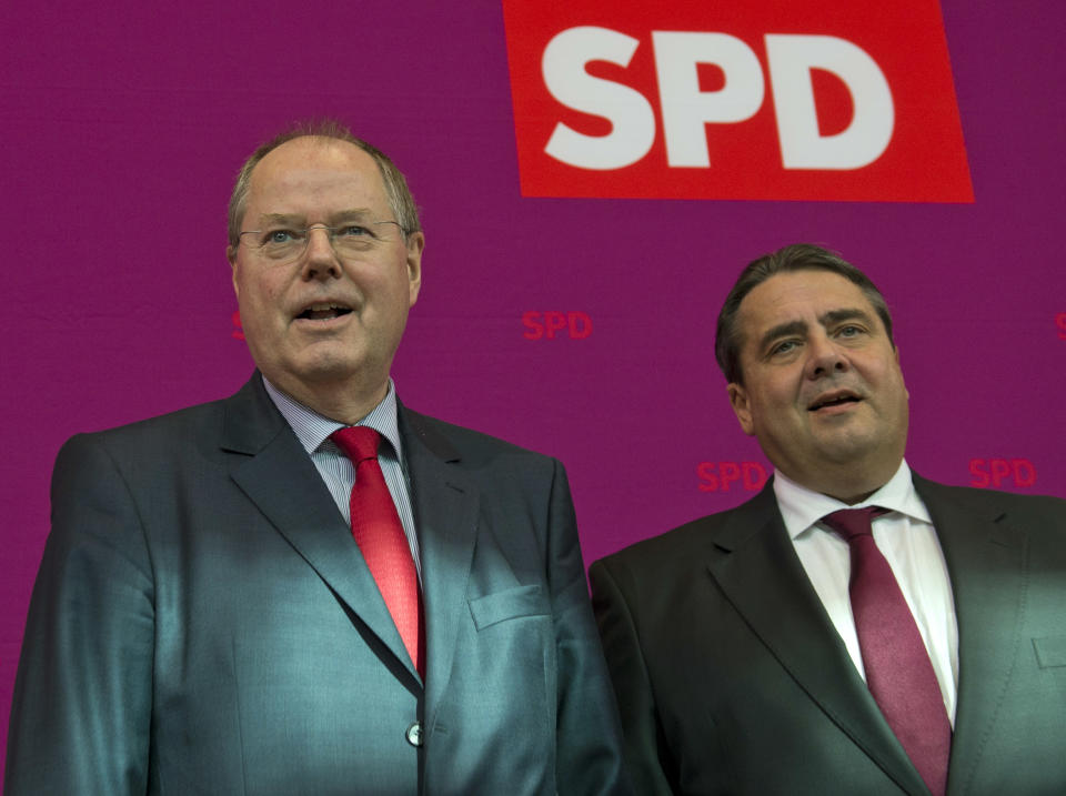 Angela Merkel's designated top challenger in the general elections Peer Steinbrueck, left, and head of the German Social Democrats, SPD, Sigmar Gabriel arrive for a meeting of the party's executive committee in Berlin, Germany, Monday, Oct. 1, 2012. (AP Photo/dapd, Michael Gottschalk)