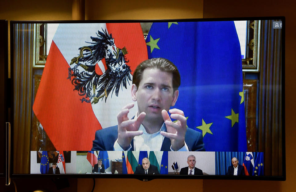 FILE - In this March 17, 2021, file photo, Austria's Chancellor Sebastian Kurz speaks to European Council President Charles Michel via a video conference meeting at the European Council building in Brussels. Leaders fight over everything from virus passports to push tourism to the conditions for receiving pandemic aid relief. Kurz decried how vaccine-buying in the bloc had become a “bazaar,” alleging poorer countries struck out while the rich thrived. (John Thys, Pool via AP, File)