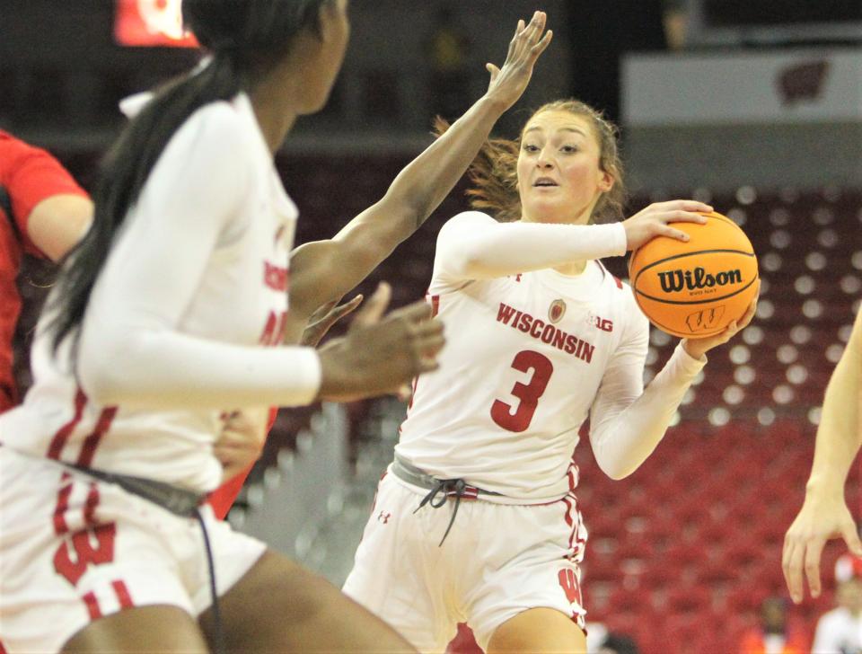 Wisconsin's Brooke Schramek (3) looks to pass the ball to Serah Williams during the team's game with Maryland at the Kohl Center in Madison, Wis. on Thursday Jan. 19, 2023.