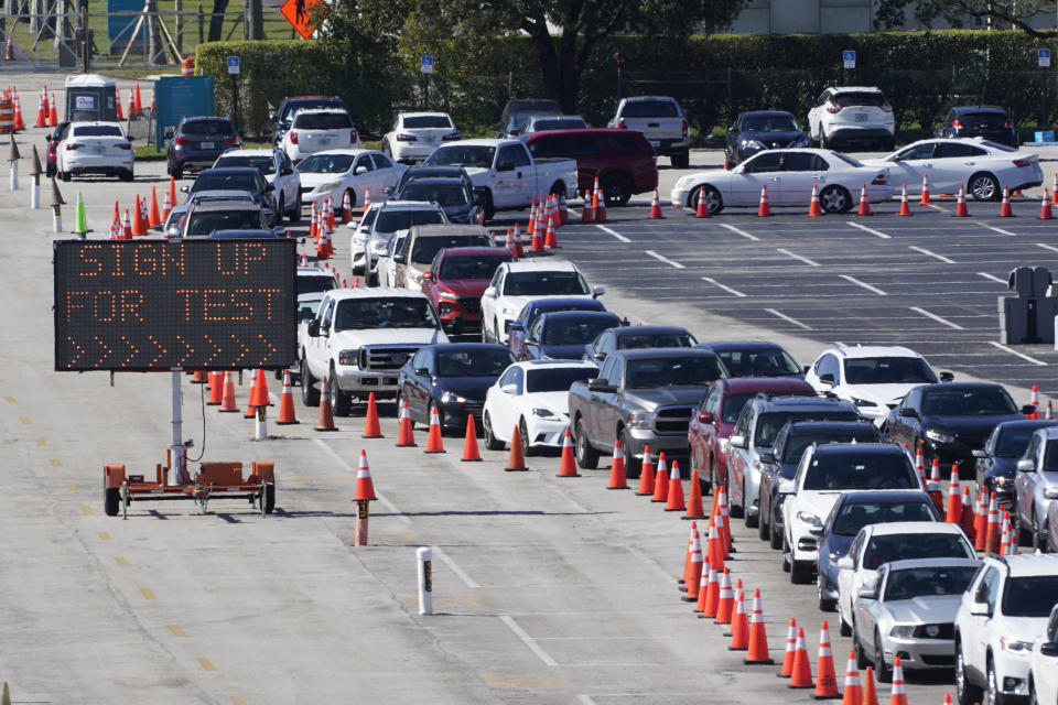 FILE - In this Jan. 5, 2021, file photo, cars line up for COVID-19 testing outside Hard Rock Stadium in Miami Gardens, Fla. Coronavirus hospitalizations are falling across the United States, but deaths have remained stubbornly high. (AP Photo/Wilfredo Lee, File)