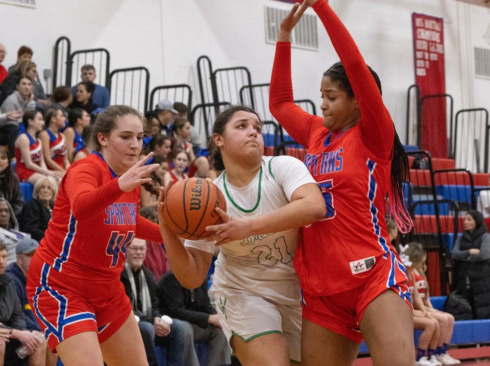 Ocean’s Ayanna Candelaria drives and tries to shoot as she’s double teamed by Ocean’s Sofia Chebookjian and Gamila Betton. Ocean Township High School Girls Basketball dominates Brick High School in NJSIAA Central Jersey Group 3 first round game in Ocean Twp. on February 22,, 2024.