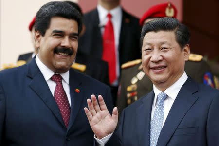 China's President Xi Jinping (R) attends a meeting with Venezuela's President Nicolas Maduro at Miraflores Palace in Caracas July 20, 2014. REUTERS/Jorge Silva/Files