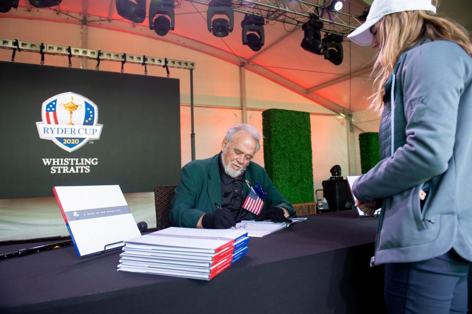 Kohler Company Executive Chairman Herbert V. Kohler, Jr., autographs the book, "A Walk to the Ryder Cup", during the kick off for the Kohler Golf Party, Wednesday, September 22, 2021, in Kohler, Wis. The Kohler Golf Party is a celebration of the Ryder Cup visit to Whistling Straits which allows all community members to participate.