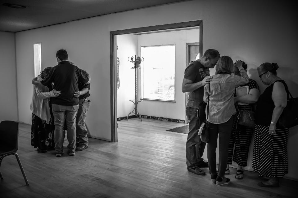 Church-goers pray after services at Iglecia Bautista Church on Sunday, May 29, 2022.<span class="copyright">David Butow for TIME</span>