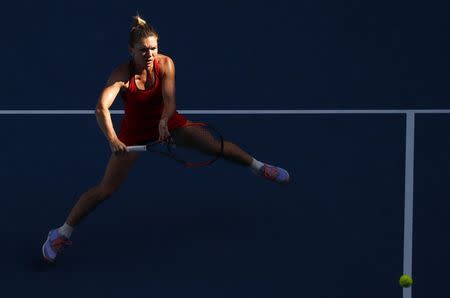 Tennis - Australian Open - Margaret Court Arena, Melbourne, Australia, January 22, 2018. Simona Halep of Romania hits a shot against Naomi Osaka of Japan. REUTERS/David Gray