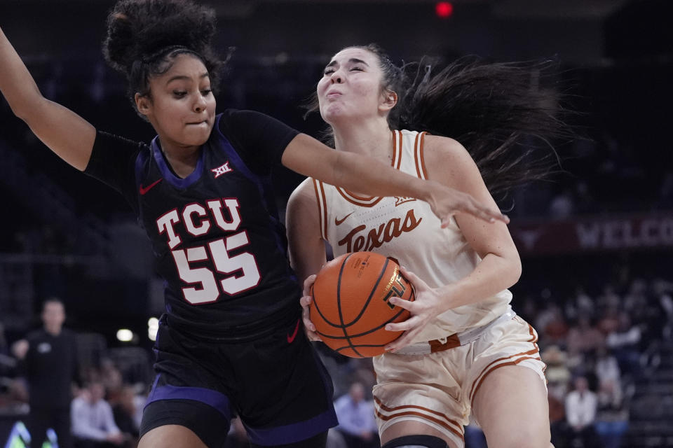 Texas guard Shaylee Gonzales, right, drives to the basket against TCU guard Victoria Flores (55) during the second half of an NCAA college basketball game in Austin, Texas, Wednesday, Jan. 10, 2024. (AP Photo/Eric Gay)