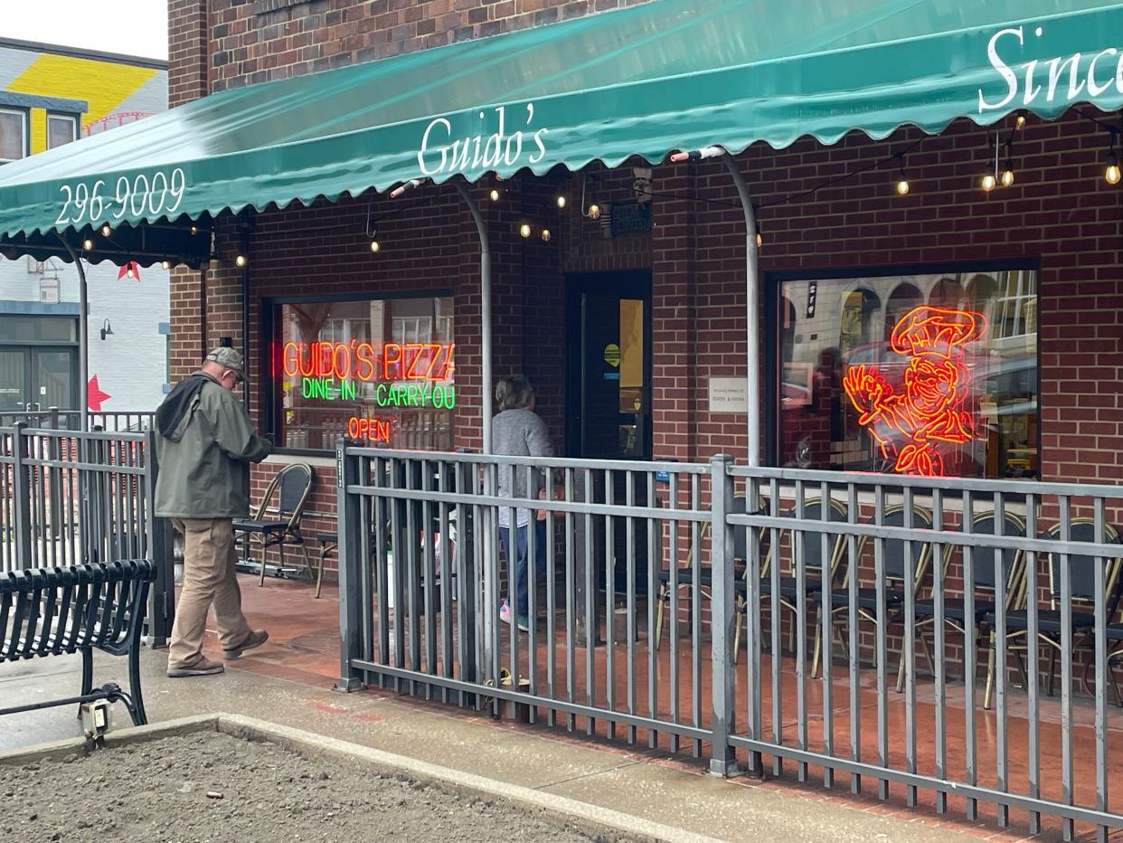 Customers make their way into Guido's in Ravenna.