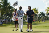 Phil Mickelson, right, shakes hands with Cameron Smith after Smith won their match during the first round of the LIV Golf Team Championship at Trump National Doral Golf Club, Friday, Oct. 28, 2022, in Doral, Fla. (AP Photo/Lynne Sladky)