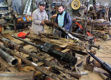 Libyan volunteers fix weapons belonging to the members of the Libyan internationally recognised government forces at a workshop in Misrata, Libya May 2, 2019. REUTERS/Ayman al-Sahili