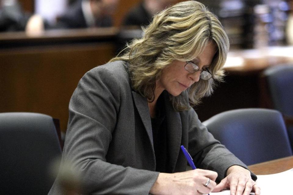 Assistant Prosecutor Michele Miller takes notes during a hearing, Tuesday, April 29, 2014, in Newark, N.J. The Star-Ledger of Newark reports that Haniyyah Barnes pleaded guilty to breaking into her neighbor's home, grabbing the 2-year-old Shih Tzu and throwing the dog into oncoming traffic in August 2011, where she was struck by a vehicle and killed. Barnes will be sentenced July 14. (AP Photo/The Star-Ledger, Patti Sapone, Pool)