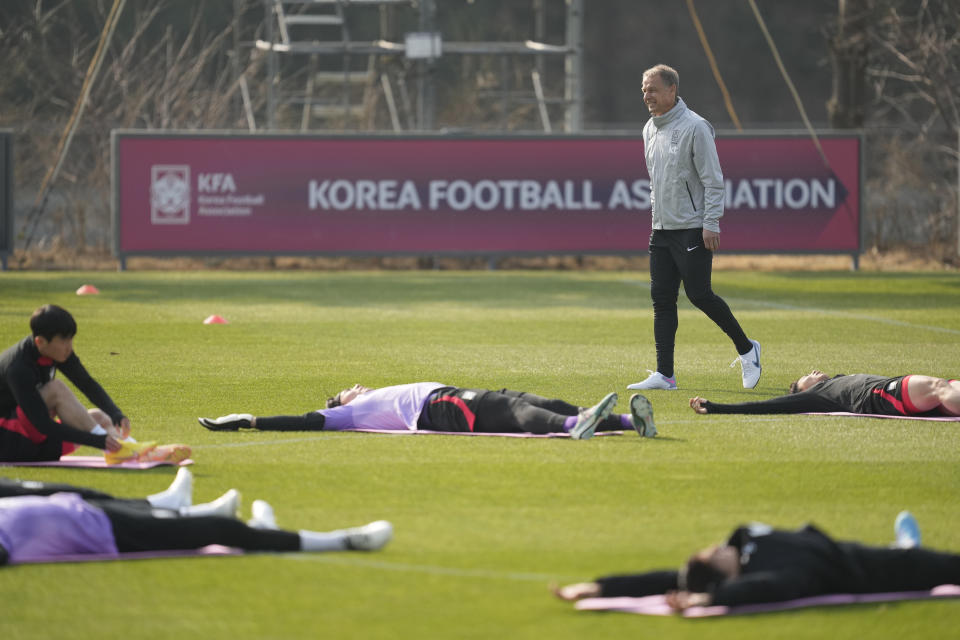 South Korea's new national team head coach Jurgen Klinsmann watches players warm up during a training session at the National Football Center in Paju, South Korea, Monday, March 20, 2023. The team will have international friendly soccer matches with Colombia on March 24 and Uruguay on March 28. (AP Photo/Lee Jin-man)