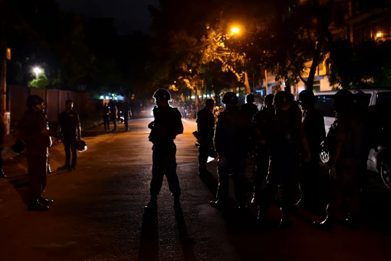 Bangladeshi security personnel stand guard after gunmen stormed a cafe in Dhaka's high-security diplomatic district early on July 2, 2016