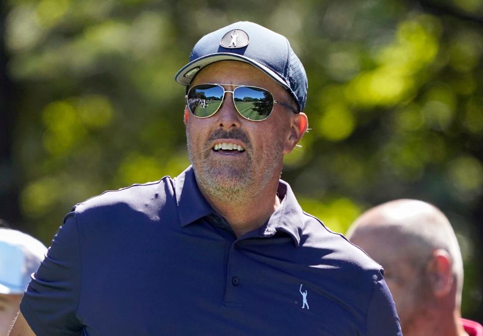 The sunglasses of Phil Mickelson reflect the second fairway following his tee shot on the second during the first round of the LIV golf tournament on Sept. 2 in Bolton.