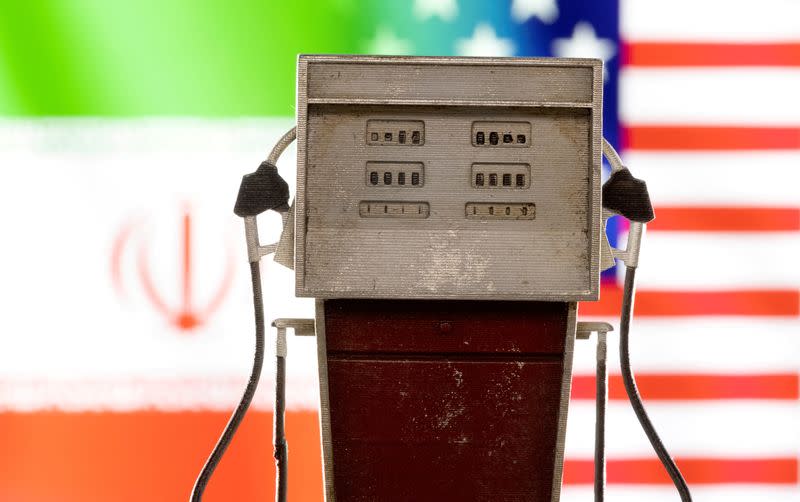 FILE PHOTO: Illustration shows model of petrol pump, U.S. and Iran flag colors