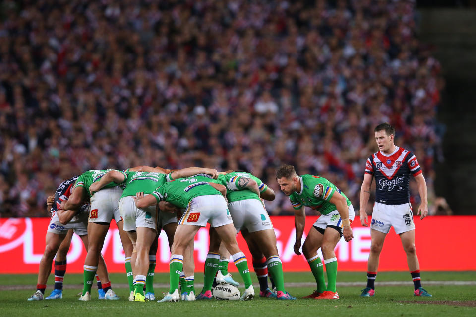 Aidan Sezer feeds the ball into the scrum against the Roosters.