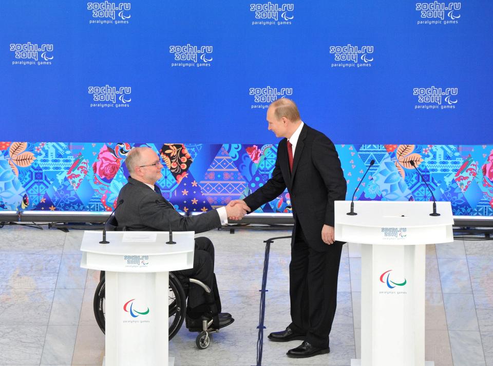 Russian President Vladimir Putin, right, shakes hands with President of the International Paralympic Committee Philip Craven during a meeting with heads of national paralympic committees in Sochi, Russia, Thursday, March 13, 2014. (AP Photo/RIA Novosti Kremlin, Mikhail Klimentyev, Presidential Press Service)