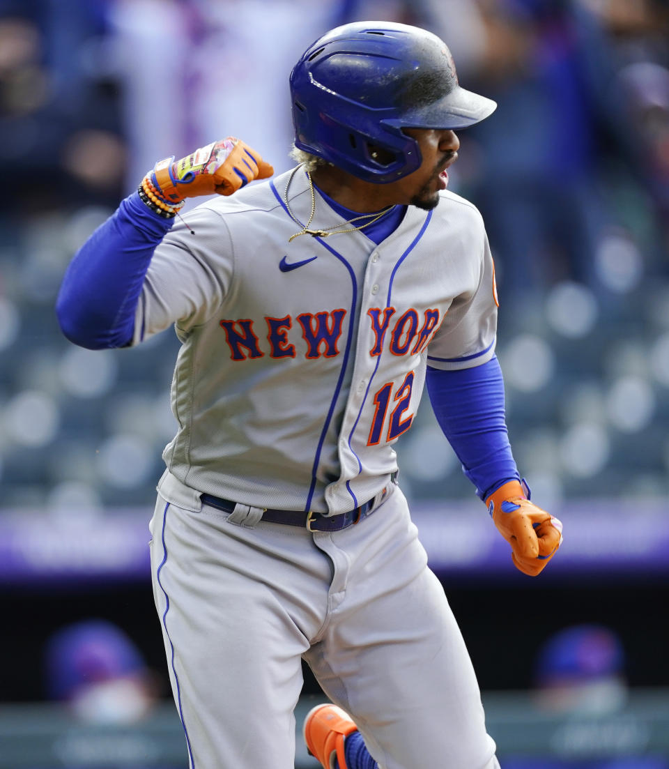 New York Mets' Francisco Lindor reacts as he heads up the first-base line after hitting an RBI single off Colorado Rockies relief pitcher Daniel Bard during the seventh inning of a baseball game Saturday, April 17, 2021, in Denver. The Mets won 4-3 in the first game of a doubleheader. (AP Photo/David Zalubowski)