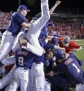 Mississippi celebrates their victory over Louisiana Lafayette during an NCAA college baseball tournament super regional game in Lafayette, La.,Monday, June 9, 2014. Mississippi won 10-4 to advance to the College World Series. (AP Photo/Gerald Herbert)
