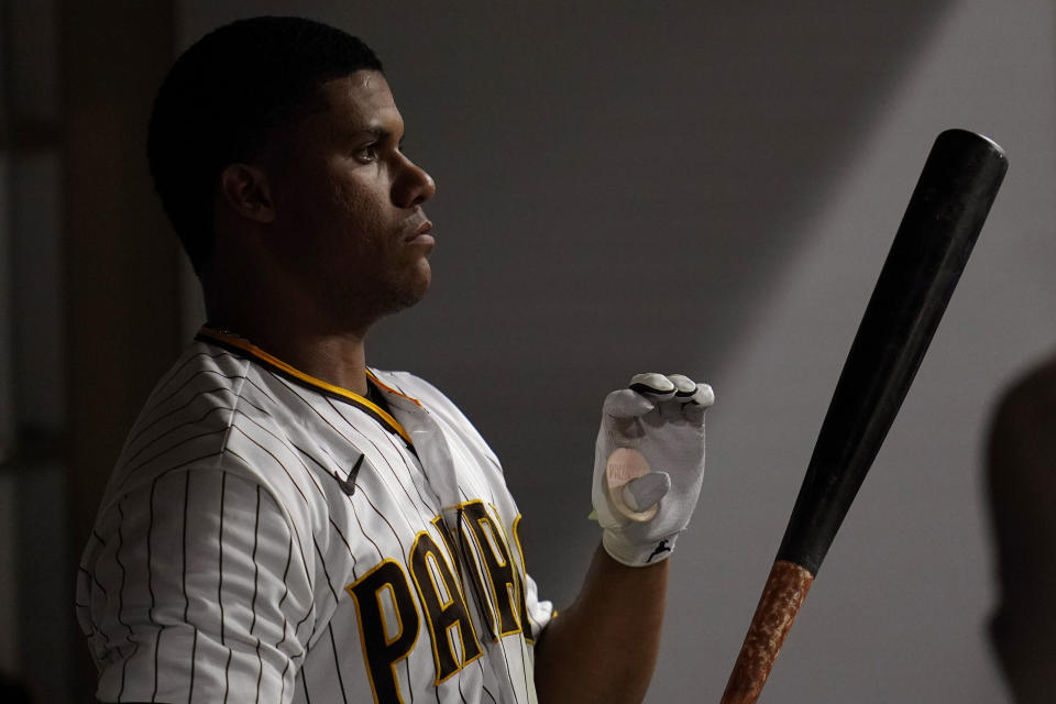 San Diego Padres' Juan Soto waits in the dugout to bat during the seventh inning of the team's baseball game against the Washington Nationals, Thursday, Aug. 18, 2022, in San Diego. (AP Photo/Gregory Bull)