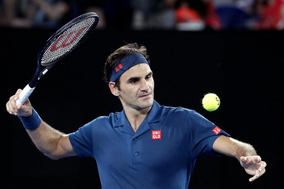 Switzerland's Roger Federer celebrates after defeating Uzbekistan's Denis Istomin during their first round match at the Australian Open tennis championships in Melbourne, Australia, Monday, Jan. 14, 2019. (AP Photo/Aaron Favila)