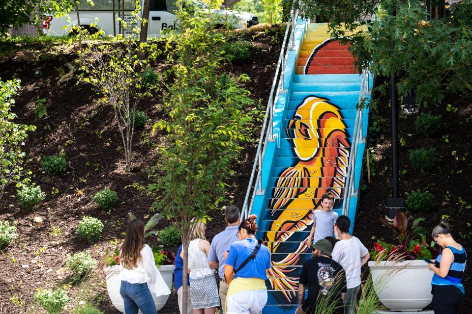 A new mural, depicting a koi fish, decorates a staircase near the intersection of 23rd Street and Ingersoll Avenue in Des Moines. The mural, organized by The Avenues of Ingersoll & Grand, aims to boost walkability while contributing to a push in public art in the area. The koi fish was painted by Des Moines-based artists Jordan Sandquist and Chris Sullivan.