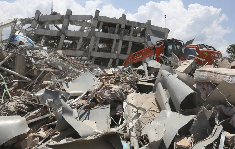 Rescue teams continue to search through the wreckage of the Roa-Roa Hotel following earthquakes and a tsunami in Palu, Central Sulawesi Indonesia, Wednesday, Oct. 3, 2018. Aid has yet to reach the hardest-hit areas around Palu, the largest city heavily damaged in the earthquake and tsunami that hit on Friday, Sept. 28. (AP Photo/Tatan Syuflana)