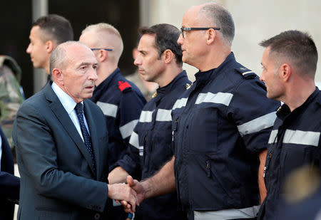 French Interior Minister Gerard Collomb meets with firemen outside the Saint-Charles train station after French soldiers shot and killed a man who stabbed two women to death at the main train station in Marseille, France, October 1, 2017. REUTERS/Jean-Paul Pelissier