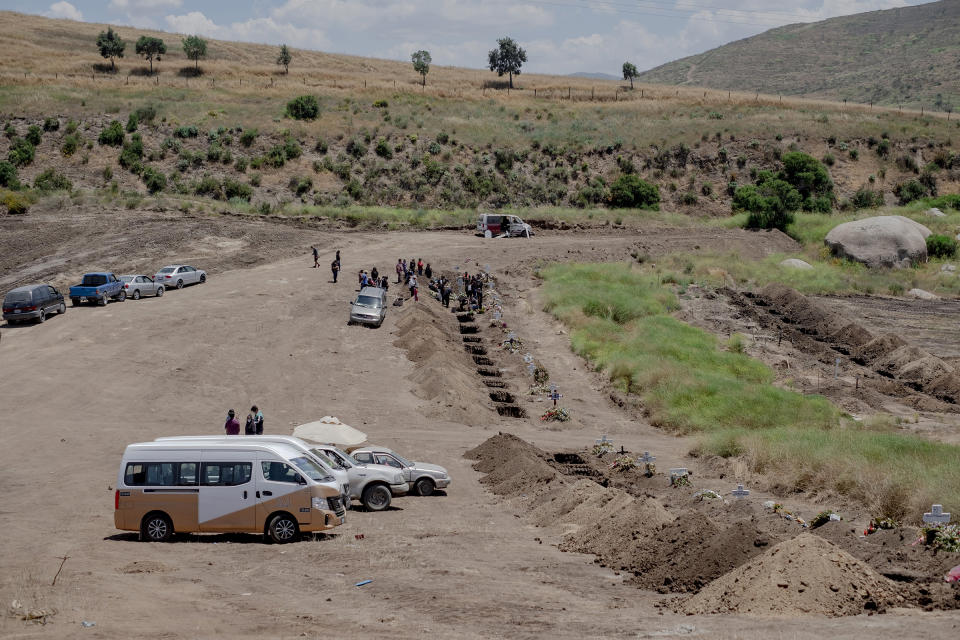 A burial at a newly dug grave at the Municipal Cemetery No. 13 in Tijuana, Mexico, on May 12. Experts say Mexico's COVID-19 case count and death toll have been underreported. | Fred Ramos—Bloomberg/Getty Images