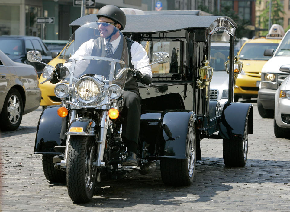 FILE - Peter Moloney, of Moloney Family Funeral Homes in Lake Ronkonkoma, N.Y., rides his Harley Davidson hearse from the Tombstone Hearse Co. of Alum Bank, Pa., in New York, May 24, 2007. Maloney was arrested Wednesday, June 7, 2023, on charges that he sprayed wasp killer at police officers and assaulted journalists — including an Associated Press photographer — during the Jan. 6, 2021, riot at the U.S. Capitol, authorities said. (AP Photo/Richard Drew, File)