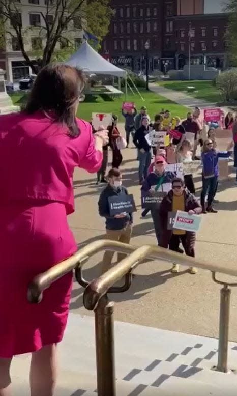 Rochester Republican state Rep. Susan DeLemus screams "shame on you" and "murderers" at people gathering at the Statehouse to abortion rights Thursday, May 5, 2022.