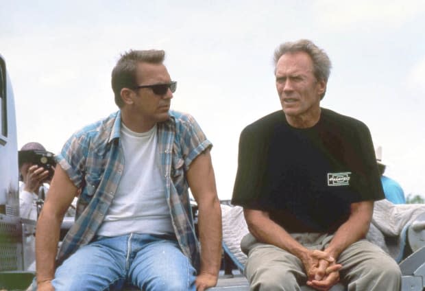 <p>Kevin Costner with actor, director and producer <a href="https://parade.com/1261389/debrawallace/clint-eastwood-children/" rel="nofollow noopener" target="_blank" data-ylk="slk:Clint Eastwood;elm:context_link;itc:0;sec:content-canvas" class="link ">Clint Eastwood</a> on the set of Eastwood's film A Perfect World. </p>