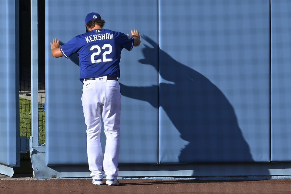 Los Angeles Dodgers starting pitcher Clayton Kershaw stretches during baseball training for the team Monday, July 6, 2020, in Los Angeles. (AP Photo/Mark J. Terrill)