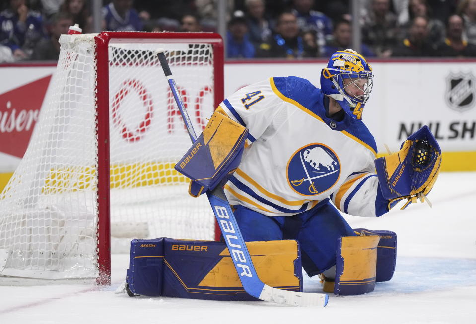 Buffalo Sabres goalie Craig Anderson makes a glove save during the third period of the team's NHL hockey game against the Vancouver Canucks on Saturday, Oct. 22, 2022, in Vancouver, British Columbia. (Darryl Dyck/The Canadian Press via AP)