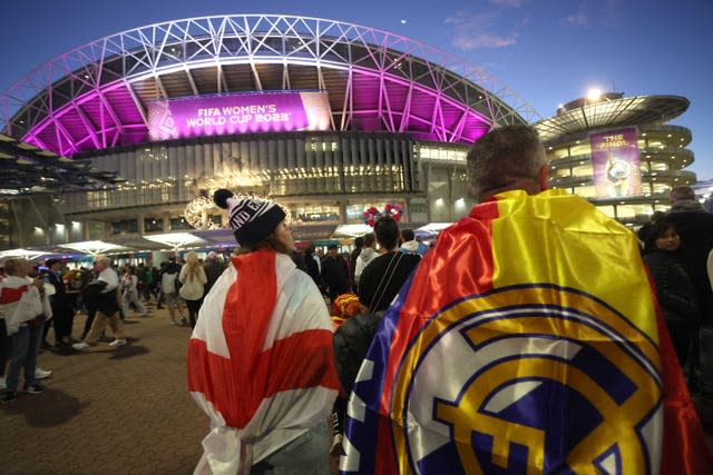 Fans draped in England and Real Madrid flags show their support prior to the Women's World Cup final