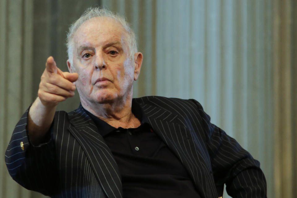 FILE -- Daniel Barenboim, general music director of the Berlin State Opera and the Staatskapelle Berlin, gestures during a press conference in Berlin, Germany, Tuesday, June 4, 2019. Daniel Barenboim on Friday announced his resignation as the general music director of Berlin's Staatsoper, a job that he has held for over three decades, saying that his health has become too poor to carry on. (AP Photo/Markus Schreiber, file)